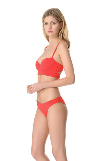 This beautiful and bright Mara Hoffman Quilts Bikini Top ($121) is a timeless suit. The design has flattering lines, while two thick straps across the back make sure everything stays in place.
This beautiful and bright Mara Hoffman Quilts Bikini Top ($121) is a timeless suit. The design has flattering lines, while two thick straps across the back make sure everything stays in place.