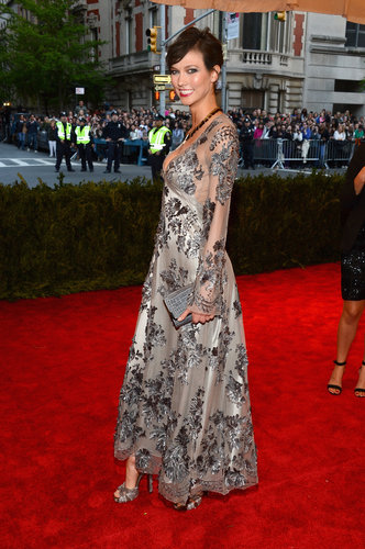 Karlie Kloss opted for a long-sleeved metallic embroidered Louis Vuitton gown and matching platform sandals.
Karlie Kloss opted for a long-sleeved metallic embroidered Louis Vuitton gown and matching platform sandals.