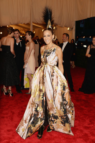 Sarah Jessica Parker delivered the most drama in a printed Giles gown, Christian Louboutin boots, and a Philip Treacy headpiece.
Sarah Jessica Parker delivered the most drama in a printed Giles gown, Christian Louboutin boots, and a Philip Treacy headpiece.