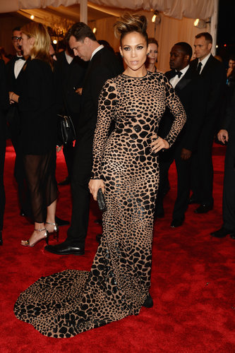 Jennifer Lopez's custom black leopard, sequin-embroidered Michael Kors gown was a lesson in formfitting tailoring. She added a Christian Louboutin clutch and Dana Rebecca earrings to boot.
Jennifer Lopez's custom black leopard, sequin-embroidered Michael Kors gown was a lesson in formfitting tailoring. She added a Christian Louboutin clutch and Dana Rebecca earrings to boot.