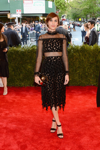 Alexa Chung's black Erdem dress featured the most delicate of details: a ruffle neck, sheer sleeves, and fringe skirt.
Alexa Chung's black Erdem dress featured the most delicate of details: a ruffle neck, sheer sleeves, and fringe skirt.