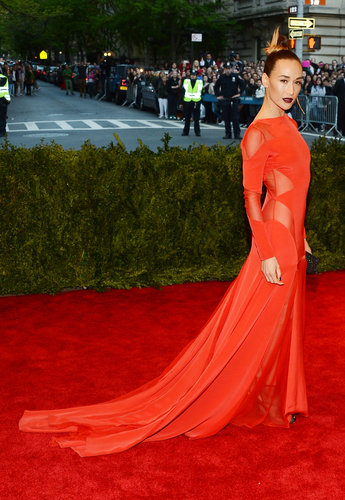 Maggie Q's fiery red Prabal Gurung gown mixed glamour with sex appeal, thanks to a long train and sheer inserts at the side and shoulders.
Maggie Q's fiery red Prabal Gurung gown mixed glamour with sex appeal, thanks to a long train and sheer inserts at the side and shoulders.
