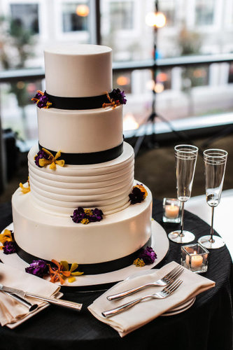 Black ribbon and a few bright flowers pop against the white frosting on this modern stunner.
Photo by Joshua Albanese Photography via Style Me Pretty
Black ribbon and a few bright flowers pop against the white frosting on this modern stunner.
Photo by Joshua Albanese Photography via Style Me Pretty