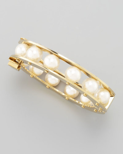 The strand of pearls your grandmother got for a big life event has been updated — this Lele Sadoughi bangle ($250) has the same classic feel with a modern design.
The strand of pearls your grandmother got for a big life event has been updated — this Lele Sadoughi bangle ($250) has the same classic feel with a modern design.
