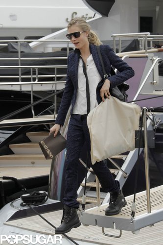 Cara Delevingne boarded Roberto Cavalli's yacht in Cannes rocking a navy pant suit with black biker boots.
Cara Delevingne boarded Roberto Cavalli's yacht in Cannes rocking a navy pant suit with black biker boots.