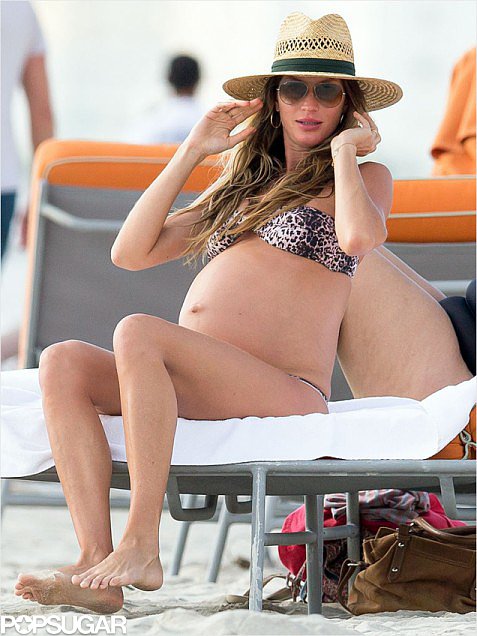 Gisele Bündchen took her bump down to Miami for a weekend getaway with husband Tom Brady while expecting baby number two. She rocked an animal-print bikini on the beach and a large hat to shield her face from the sun.
Gisele Bündchen took her bump down to Miami for a weekend getaway with husband Tom Brady while expecting baby number two. She rocked an animal-print bikini on the beach and a large hat to shield her face from the sun.