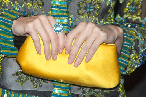 Paz Vega wore a circular blue ring and carried a satin yellow clutch.
Paz Vega wore a circular blue ring and carried a satin yellow clutch.