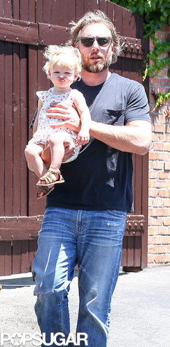 Eric Johnson toted his daughter Maxwell, who sported her usual pout.
Eric Johnson toted his daughter Maxwell, who sported her usual pout.