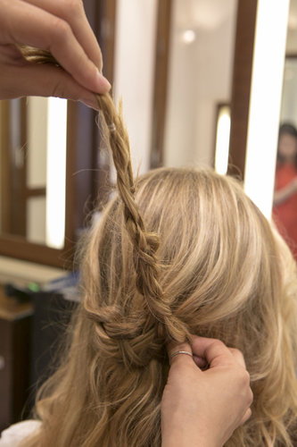 Lay that bend in the braid to the right to create the half-up shape.
Lay that bend in the braid to the right to create the half-up shape.