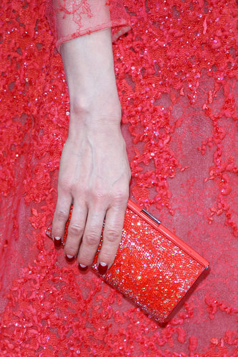 Dita Von Teese carried a red sparkly clutch to match her intricate gown.
Dita Von Teese carried a red sparkly clutch to match her intricate gown.