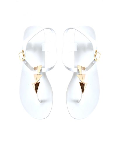 Flashy gold triangles give Missguided's simple white thong ($26) a fierce feeling.
Flashy gold triangles give Missguided's simple white thong ($26) a fierce feeling.