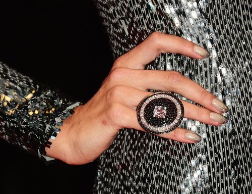 Alessandra Ambrosio wore a large circular ring to match her shimmering dress.
Alessandra Ambrosio wore a large circular ring to match her shimmering dress.