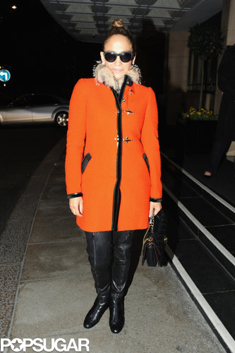 Jennifer Lopez wore an orange coat in London.
Jennifer Lopez wore an orange coat in London.
