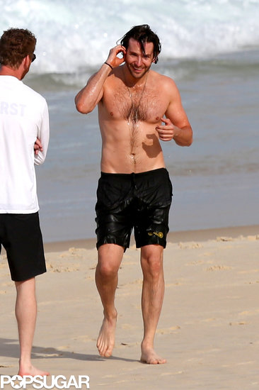 Bradley Cooper Ditches His Shirt For a Swim in Rio Bradley Cooper Ditches His Shirt For a Swim in Rio