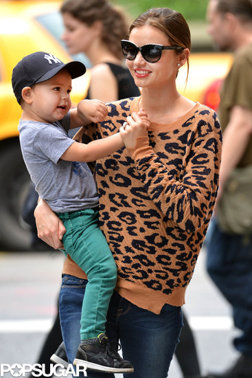 Miranda Kerr carried Flynn Bloom through a park.
Miranda Kerr carried Flynn Bloom through a park.