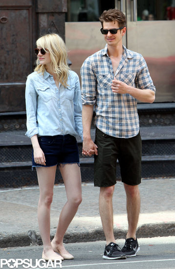 Emma Stone and Andrew Garfield stood hand in hand on an NYC street. Emma Stone and Andrew Garfield stood hand in hand on an NYC street.