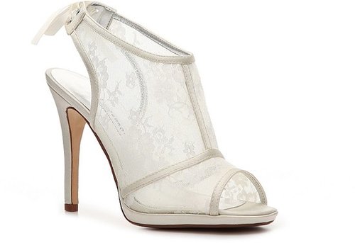 If you're on a budget but still seek something sophisticated and statement-making, we recommend these Caparros lace peep-toe sandals ($65). They scream bridal, but the shape gives them an edgier twist.
If you're on a budget but still seek something sophisticated and statement-making, we recommend these Caparros lace peep-toe sandals ($65). They scream bridal, but the shape gives them an edgier twist.