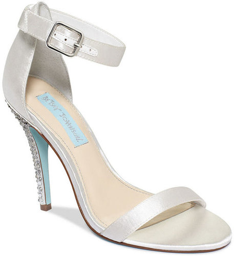 A simple ankle-strap silhouette, like this Betsey Johnson pair ($99), can lengthen the leg without taking the focus away from the dress.
A simple ankle-strap silhouette, like this Betsey Johnson pair ($99), can lengthen the leg without taking the focus away from the dress.