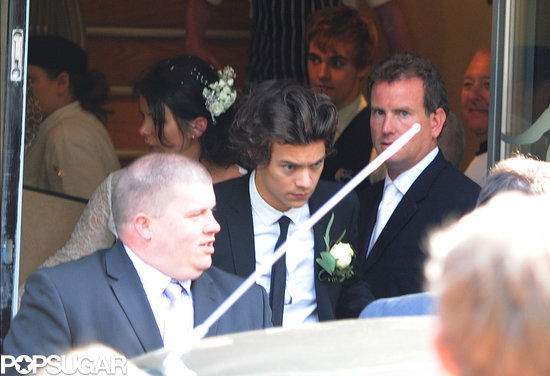 Harry Styles wore a boutonniere and a black suit.
Harry Styles wore a boutonniere and a black suit.