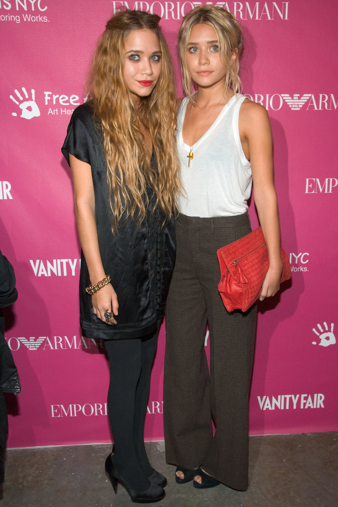 Twinning combo: Mary-Kate and Ashley showed yet another example of their fashion prowess, working Winter-ready looks for the seventh annual Art + Photography Auction Benefit in 2006.
Mary-Kate layered up in a silky tunic, opaque tights, and satin pumps.
Ashley tucked a fitted white tank into high-waisted herringbone trousers, then finished off with a woven red clutch.
Twinning combo: Mary-Kate and Ashley showed yet another example of their fashion prowess, working Winter-ready looks for the seventh annual Art + Photography Auction Benefit in 2006.
Mary-Kate layered up in a silky tunic, opaque tights, and satin pumps.
Ashley tucked a fitted white tank into high-waisted herringbone trousers, then finished off with a woven red clutch.