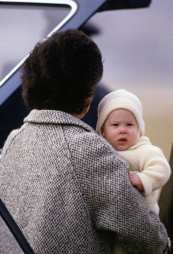 An adorably tiny Prince Harry was carried by his nanny, Barbara Barnes, in 1985.
An adorably tiny Prince Harry was carried by his nanny, Barbara Barnes, in 1985.
