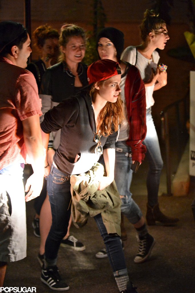 Kristen Stewart wore a red baseball hat. Kristen Stewart wore a red baseball hat.