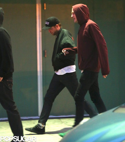 Robert Pattinson left the concert separately with a friend.
Robert Pattinson left the concert separately with a friend.