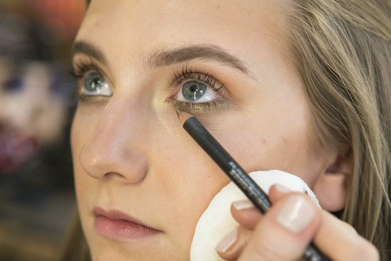 Now that the skin is warmed up and bronzer has been applied, Betelli likes to use a bronzed makeup palette to create a sultry Summer look. She started off with Eye Kohl in Powersurge ($16), a bronze-brown with golden shimmer, inside the water line and under the eyes for a soft smoky look. "My trick is to make the line extend out to where your lashes end," she says.
Now that the skin is warmed up and bronzer has been applied, Betelli likes to use a bronzed makeup palette to create a sultry Summer look. She started off with Eye Kohl in Powersurge ($16), a bronze-brown with golden shimmer, inside the water line and under the eyes for a soft smoky look. "My trick is to make the line extend out to where your lashes end," she says.