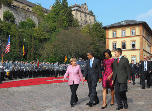 During an April 2009 NATO welcome ceremony, Barack and Michelle Obama walked with German Chancellor Angela Merkel and her husband, Joachim Sauer.
During an April 2009 NATO welcome ceremony, Barack and Michelle Obama walked with German Chancellor Angela Merkel and her husband, Joachim Sauer.