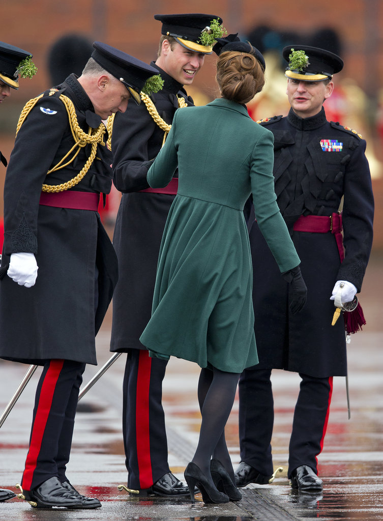 William helped Kate when her heel got stuck in a grate during a St. Patrick's Day visit to the Iris Guards in Aldershot, England, in March 2013.
William helped Kate when her heel got stuck in a grate during a St. Patrick's Day visit to the Iris Guards in Aldershot, England, in March 2013.