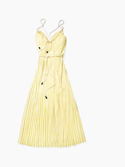 The maxi, a Summer constant, feels preppy, not boho, in Tommy's pleated, buttery yellow variety ($228).
The maxi, a Summer constant, feels preppy, not boho, in Tommy's pleated, buttery yellow variety ($228).