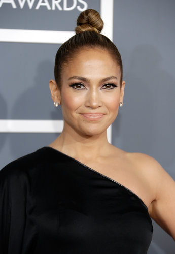 At the Grammy Awards, Jennifer Lopez went for a twisted and twirled topknot that put the focus on her exaggerated eye makeup.
At the Grammy Awards, Jennifer Lopez went for a twisted and twirled topknot that put the focus on her exaggerated eye makeup.