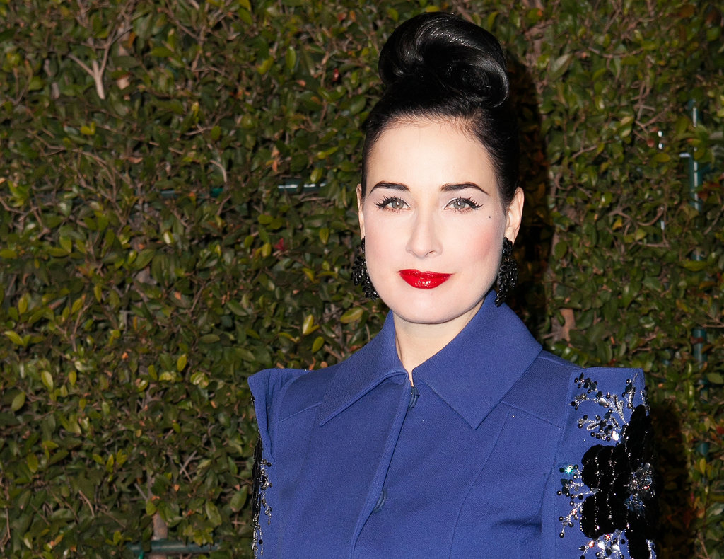 It's rare you see Dita Von Teese in anything other than vintage waves, but this updo modernizes her retro style considerably.
It's rare you see Dita Von Teese in anything other than vintage waves, but this updo modernizes her retro style considerably.