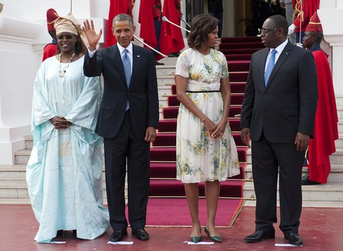 The first lady was a breath of fresh air in a retro floral dress and green kitten pumps as she and President Obama were greeted by Senegal's President at the Presidential Palace in Dakar.
The first lady was a breath of fresh air in a retro floral dress and green kitten pumps as she and President Obama were greeted by Senegal's President at the Presidential Palace in Dakar.