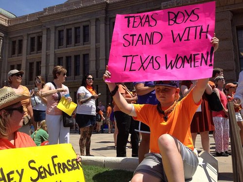 A young boy held up a poster during the protest.
Source: Twitter user dallasdemocrats
A young boy held up a poster during the protest.
Source: Twitter user dallasdemocrats
