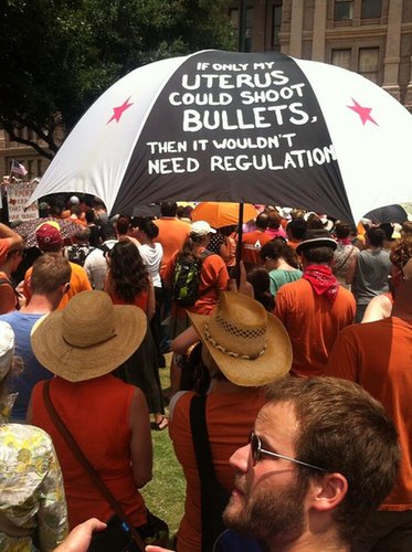One woman held up an umbrella painted with her message.
Source: Twitter user rketexas
One woman held up an umbrella painted with her message.
Source: Twitter user rketexas