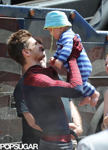 Andrew Garfield had fun with a baby between takes on the Amazing Spider-Man 2 set in NYC.
Andrew Garfield had fun with a baby between takes on the Amazing Spider-Man 2 set in NYC.