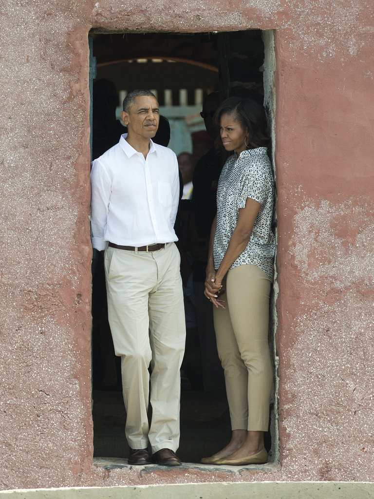 The first lady was laid-back but undeniably put-together in khaki cropped trousers and a printed blouse while visiting the Door of No Return in Dakar with the president.
The first lady was laid-back but undeniably put-together in khaki cropped trousers and a printed blouse while visiting the Door of No Return in Dakar with the president.