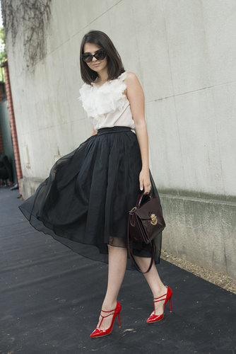 Classic black and white was brightened up by a vibrant red shoe.
Classic black and white was brightened up by a vibrant red shoe.