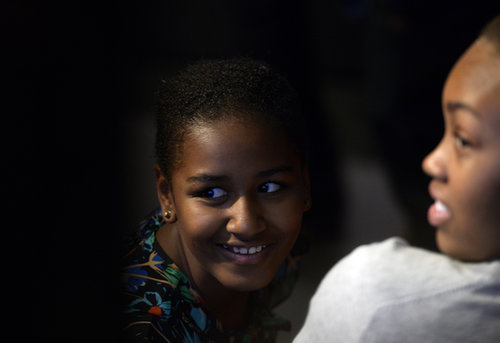 Sasha Obama smiled from the audience while First Lady Michelle Obama spoke with students in Johannesburg in June.
Sasha Obama smiled from the audience while First Lady Michelle Obama spoke with students in Johannesburg in June.