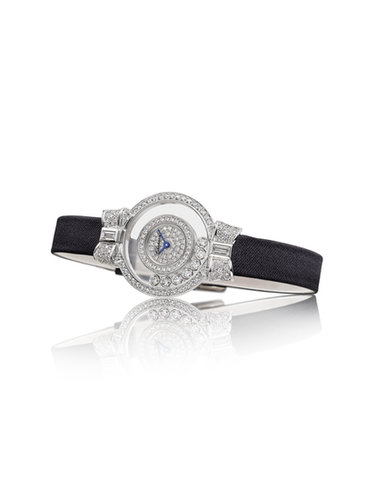 Chopard Happy Diamonds collection diamond timepiece, featuring a baguette and brilliant-cut white diamond face set in 18-karat white gold on a black satin strap.
Source: Chopard
Chopard Happy Diamonds collection diamond timepiece, featuring a baguette and brilliant-cut white diamond face set in 18-karat white gold on a black satin strap.
Source: Chopard