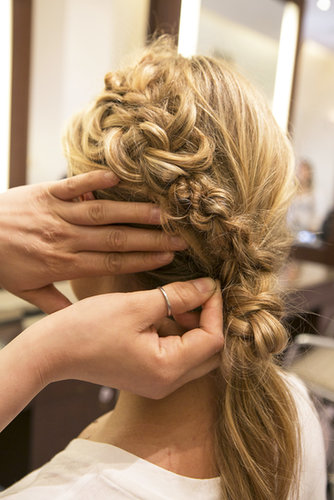 Bring the knotted hair up and connect it with the braid on the left side and pin it in place.
Bring the knotted hair up and connect it with the braid on the left side and pin it in place.