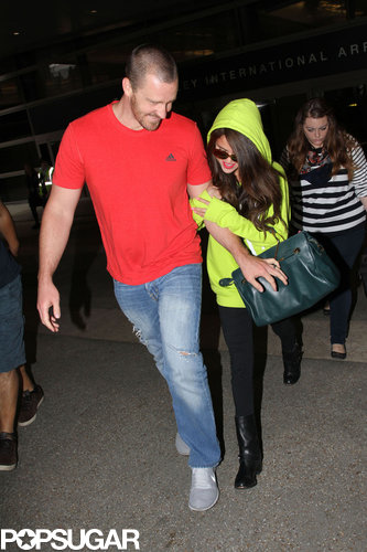 Selena Gomez wore a neon hoodie and sunglasses.
Selena Gomez wore a neon hoodie and sunglasses.