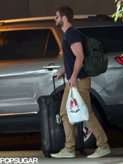 Liam Hemsworth helped carry Miley Cyrus's luggage.
Liam Hemsworth helped carry Miley Cyrus's luggage.