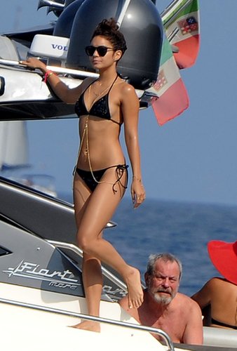 Vanessa Hudgens rocked a black triangle bikini — and a shiny gold body chain — on a yacht in Italy.
Vanessa Hudgens rocked a black triangle bikini — and a shiny gold body chain — on a yacht in Italy.