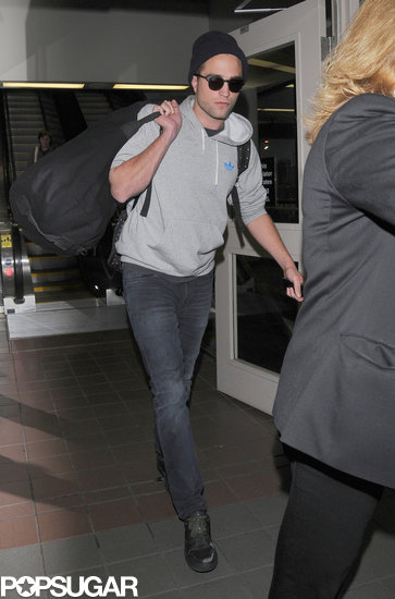 Robert Pattinson walked through LAX. Robert Pattinson walked through LAX.