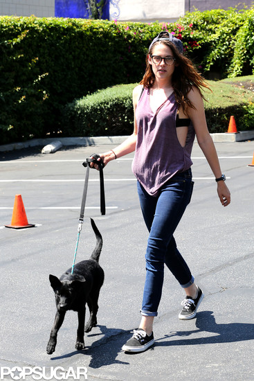 Kristen Stewart walked a black dog in LA and wore Vans tennis shoes.
Kristen Stewart walked a black dog in LA and wore Vans tennis shoes.