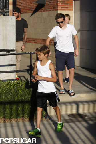 David Beckham left UCLA with his sons Brooklyn and Romeo after watching the Real Madrid practice.
David Beckham left UCLA with his sons Brooklyn and Romeo after watching the Real Madrid practice.