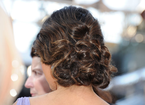 The back of her hair was intricately curled and twisted into an updo.
The back of her hair was intricately curled and twisted into an updo.