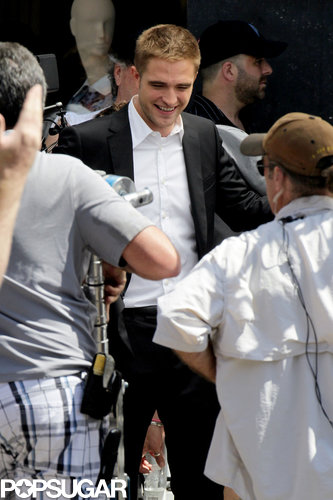Robert Pattinson wore a suit to film scenes on Rodeo Drive.
Robert Pattinson wore a suit to film scenes on Rodeo Drive.